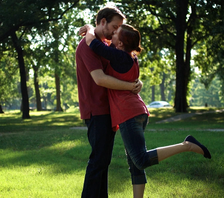 Lisa and David kissing for an engagement photo in Bartlesville, Oklahoma.